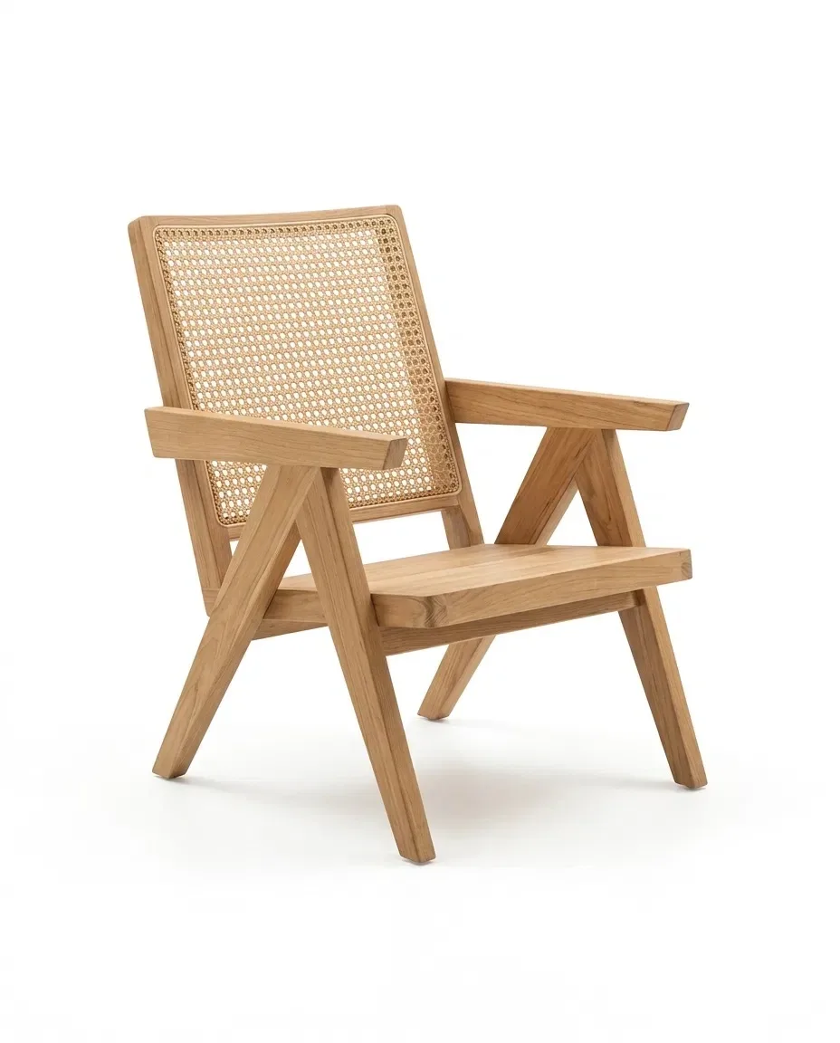 Solid teak lounge armchair with cane back and V-shaped legs, three-quarter view